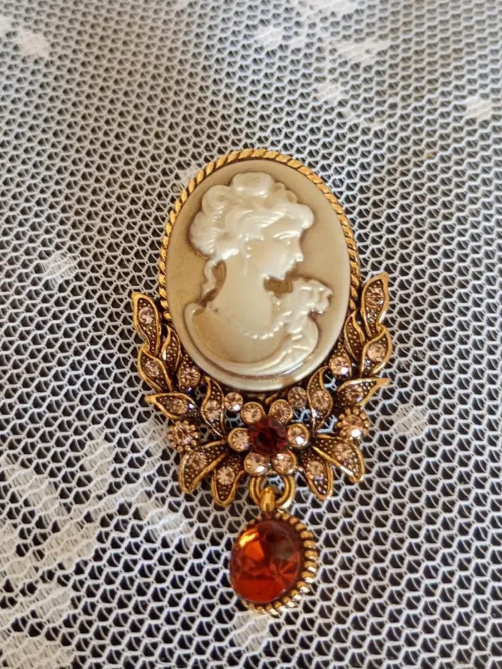 Vintage-Inspired Gold Cameo Brooch with Amber tone Crystal Drop